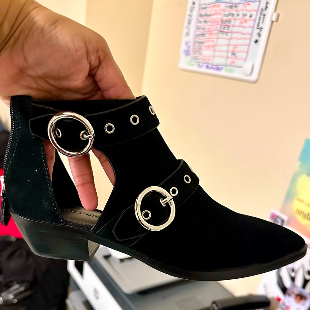 Slightly worn zip back suede small heel bootie.